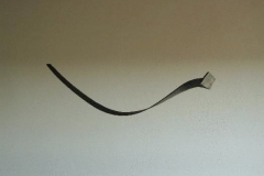 "Zeichen" Abb. 1, Holz in der Flamme gebogen, Maße ca. 180 × 20 × 5 cm³, 2006